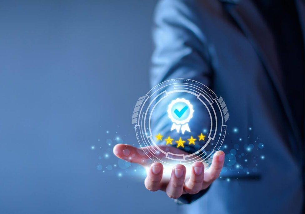 Quality Assurance Concept. Business people show high quality assurance mark, good service, premium, five stars, premium service assurance, excellence service, high quality, business excellence.